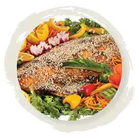 Whole poached salmon platter with vegetables