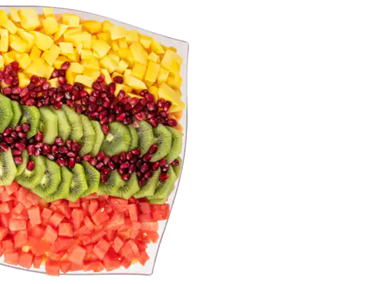 Rainbow fruit salad platter with kiwi, pineapple and berries