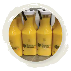 Fresh-squeezed orange juice bottles from The Green Bowl