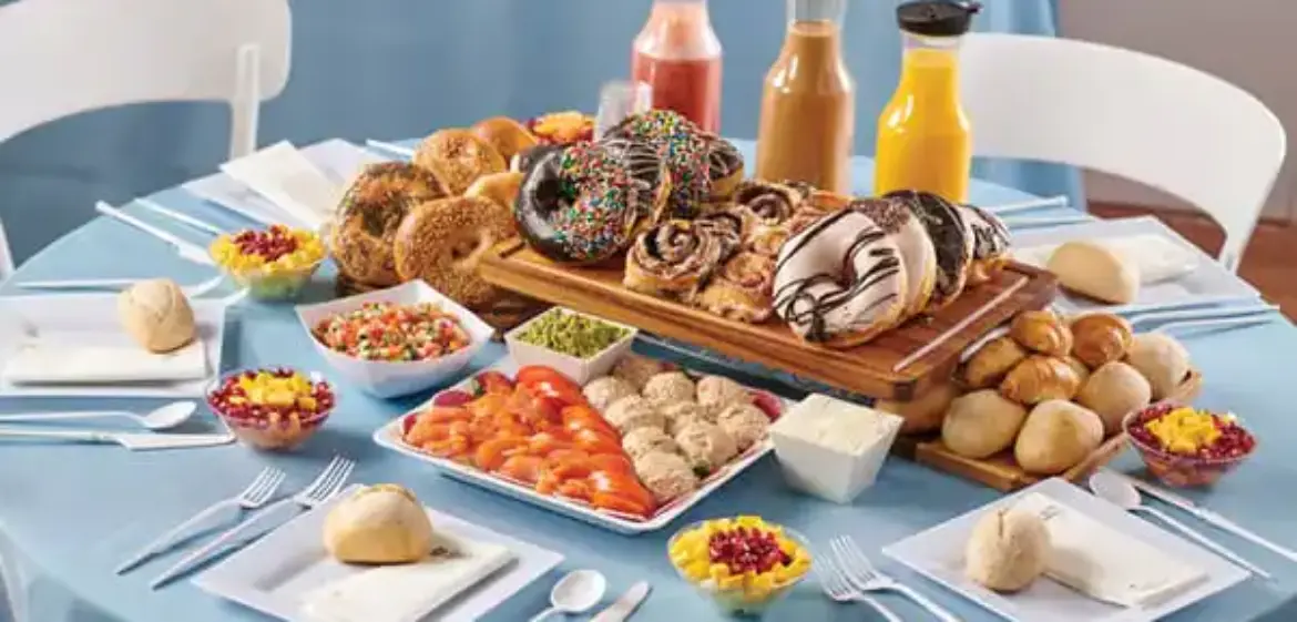 Bris brunch table with bagels, salads and juices