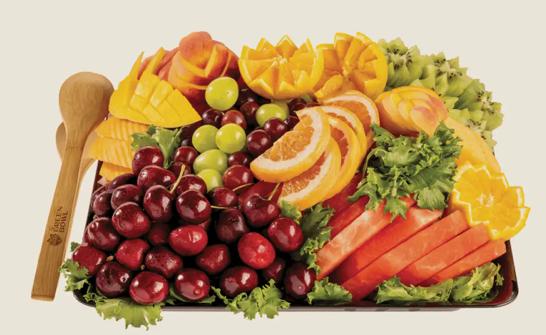 Fresh fruit platter with grapes, melon, pineapple and berries