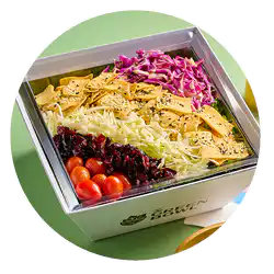 Pasta salad with red cabbage, tomatoes and greens