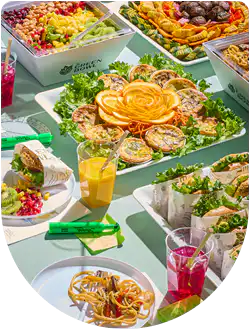 Gourmet salad boxes and fruit platter catering spread