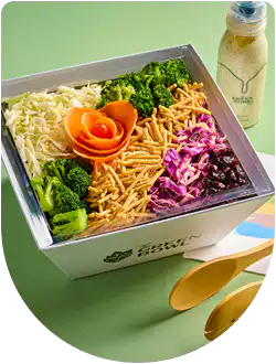 Green Bowl slaw salad with carrot rose in a gift box